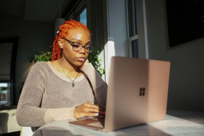 Young Woman on Laptop Medium