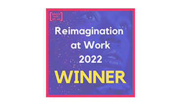 Large text in the middle of a page overlaying a purple image of someone looking forward saying "Reimagination at Work 2022 Winner" and in the top left corner the company providing the award's logo (called watch this sp_ce)